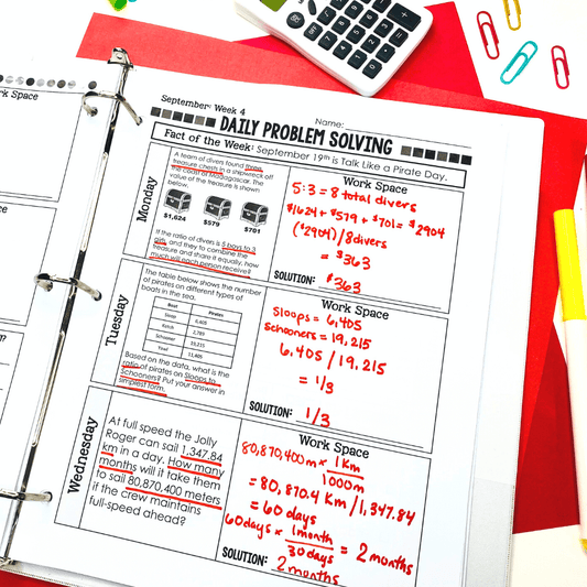 A binder displays a completed worksheet from "7th Grade Math Word Problem of the Day: Yearlong Story Problem Solving Practice for Middle School" by Differentiated Teaching with Rebecca Davies. A calculator, paper clips, and folders sit nearby on the white table.