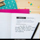 An open notebook titled “Self-Discovery” with text on daily affirmations sits beside a pen, with colorful clips and sticky notes—great for the Ramona Quimby, Age 8 by Beverly Cleary Novel Study Unit from Differentiated Teaching with Rebecca Davies.